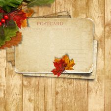 Autumn Leaves Over Wooden Background With Postcard Stock Photo Autumn Leaves Over Wooden Background With Postcard Stock Photo