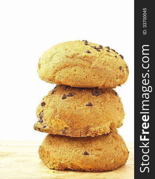 Stack of three tasty bun on wood floor in white background. Stack of three tasty bun on wood floor in white background