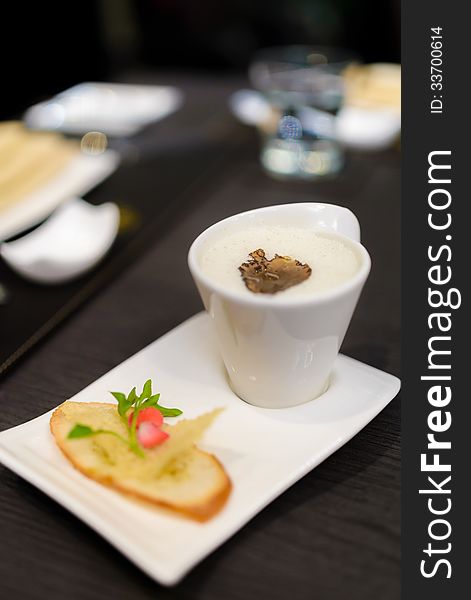 White truffle mushroom soup served with biscuit