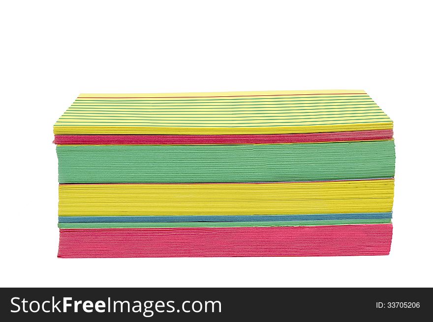 Stack of brightly colored index cards, slightly worn and isolated on white. Horizontal shot. Stack of brightly colored index cards, slightly worn and isolated on white. Horizontal shot.