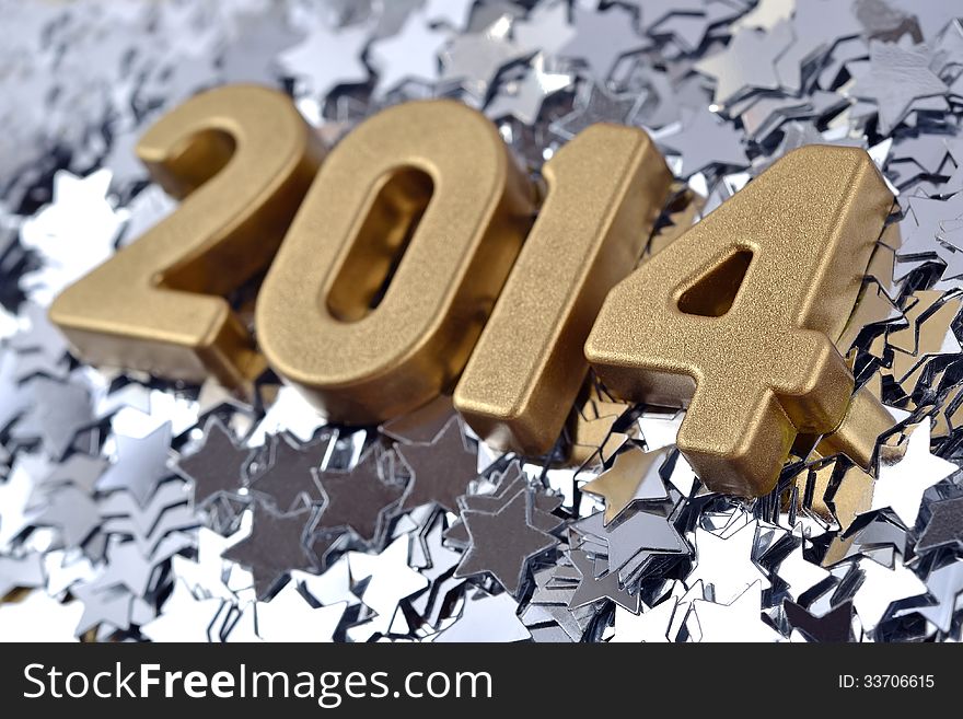 2014 year golden figures on the background of silver stars