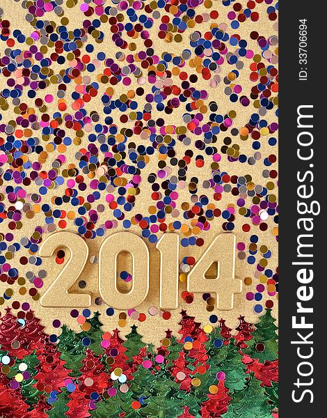 2014 year golden figures on the background of varicolored confetti