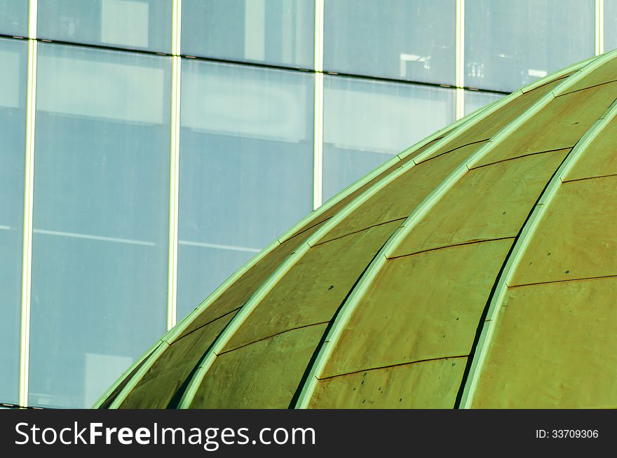 Green Copper Dome of Church with Windows of Office Block. Green Copper Dome of Church with Windows of Office Block