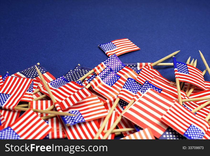 Abstract background of USA Stars and Stripes, red white and blue national toothpick flags for national emblem or public holiday event. Close up with copy space for your text here. Abstract background of USA Stars and Stripes, red white and blue national toothpick flags for national emblem or public holiday event. Close up with copy space for your text here.