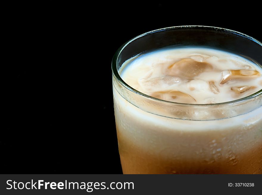 Ice Coffee milk on black background