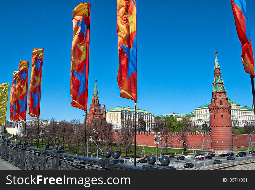 Moscow Kremlin at national holiday with flags on the street