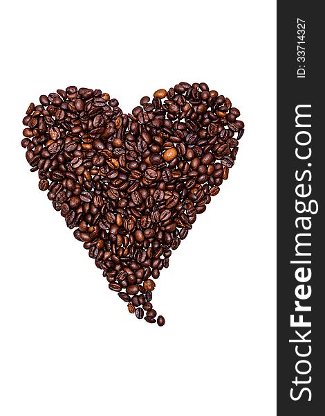 Coffee beans laid out a heart isolated on white background