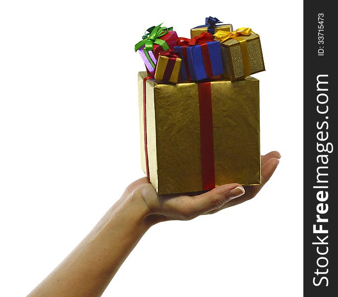 Hand with big golden box and small colorful boxes isolated. Hand with big golden box and small colorful boxes isolated