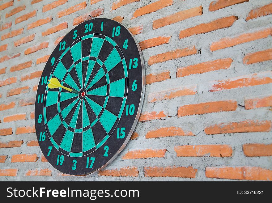 Darts on wall and background