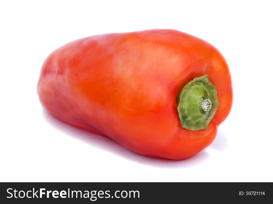 Large red pepper. Photographed close-up on a white background. Large red pepper. Photographed close-up on a white background.