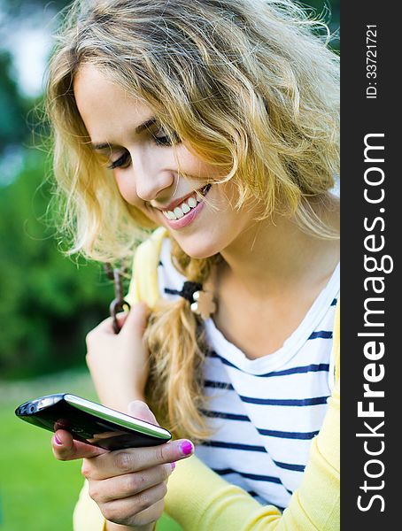 Young Blonde Girl At The Park