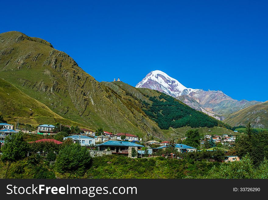 Mountain Kazbek and village Stepantsminda in Georgia. Mountain Kazbek and village Stepantsminda in Georgia