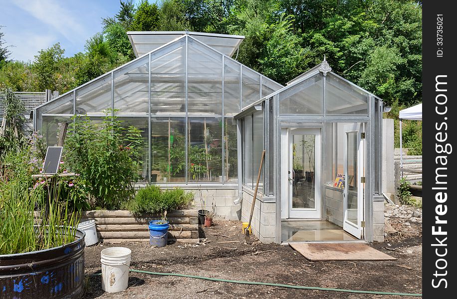 Greenhouse in garden center with trees