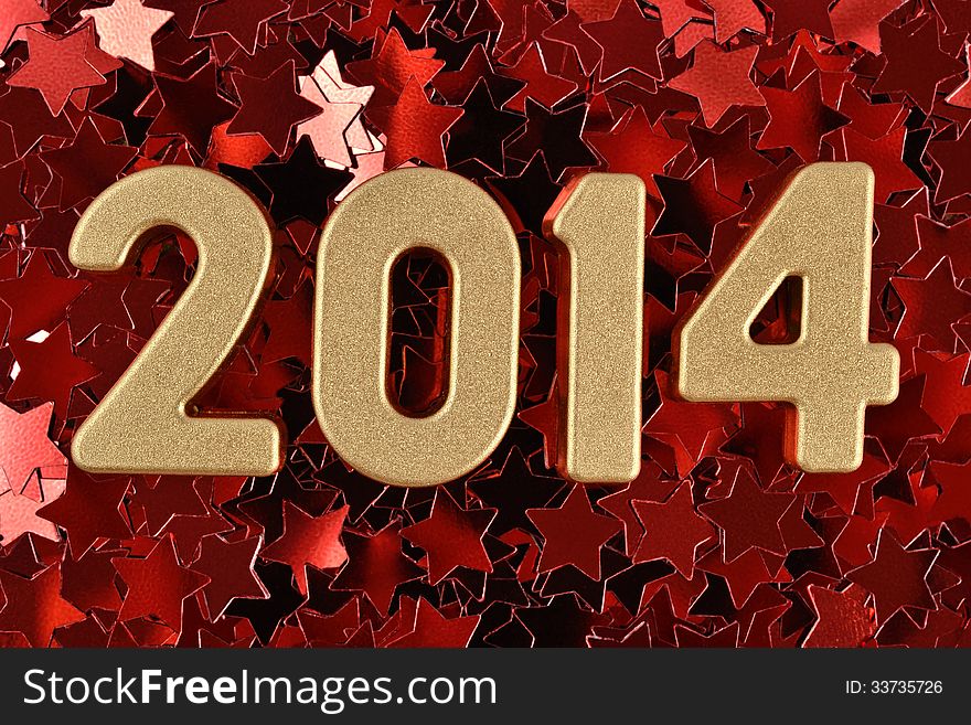 2014 year golden figures on the background of red stars