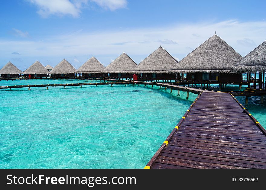 Turquoise water and Water bungalows on Maldives