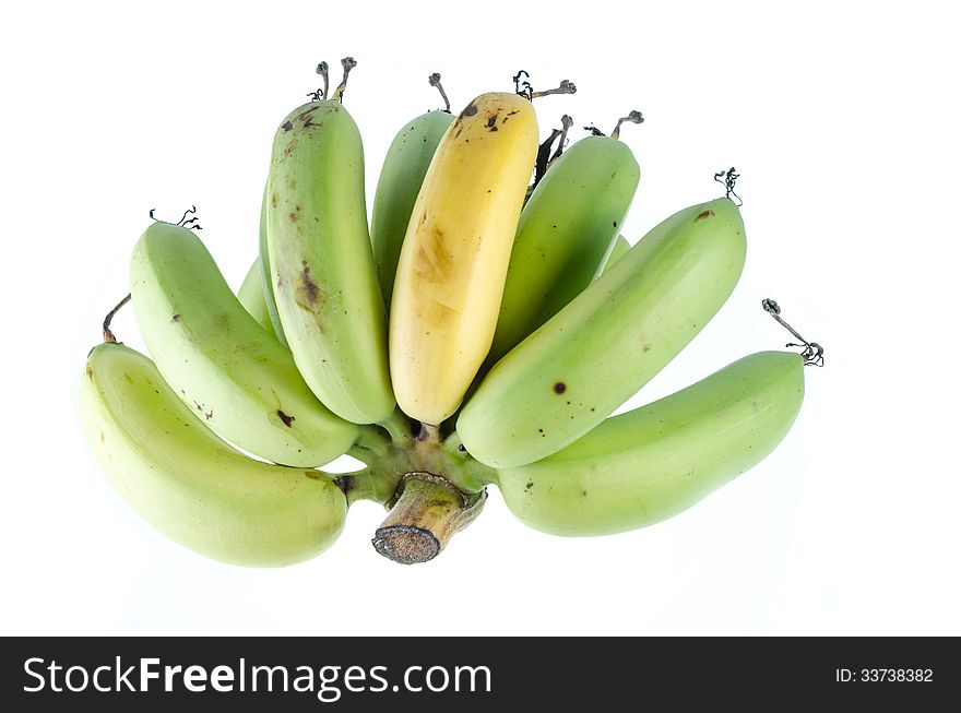 One ripe banana on raw banana