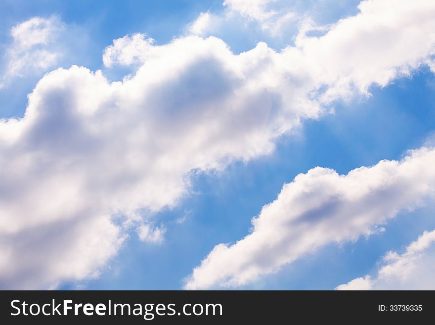 Puffy clouds sky shiny atmosphere