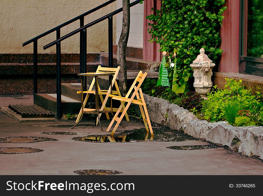 Street cafe with two chairs and little table