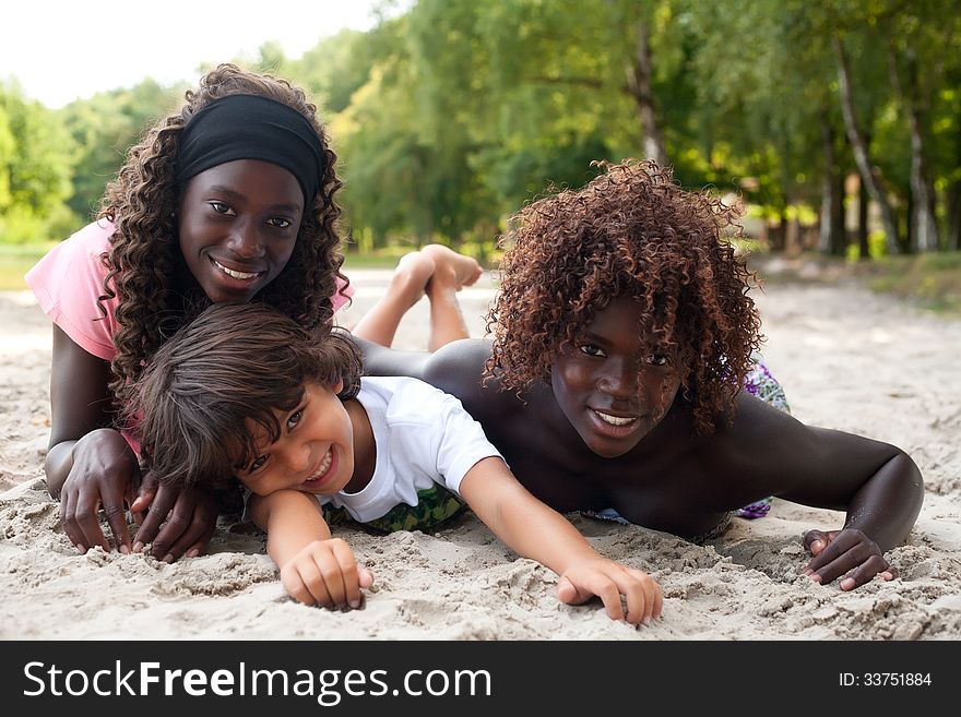 Smiling Ethnic Children On The Beach