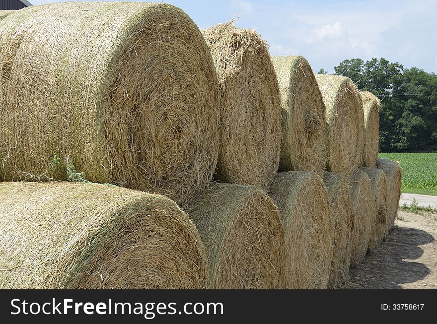 Round hay bales stacked ready