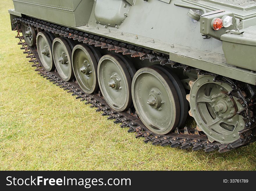 The Wheels and Tracks of a Military Armoured Vehicle.