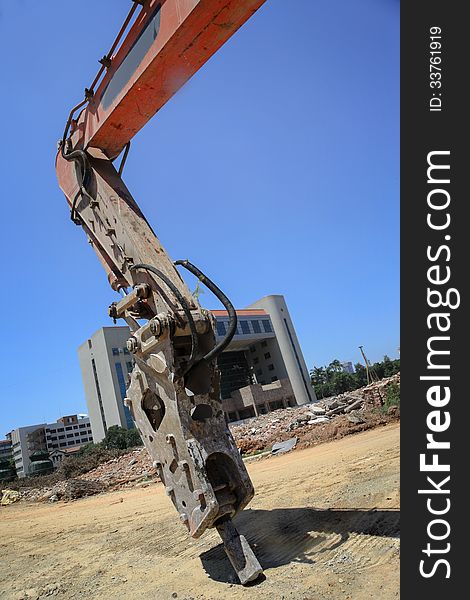 Excavator in a construction site. Excavator in a construction site