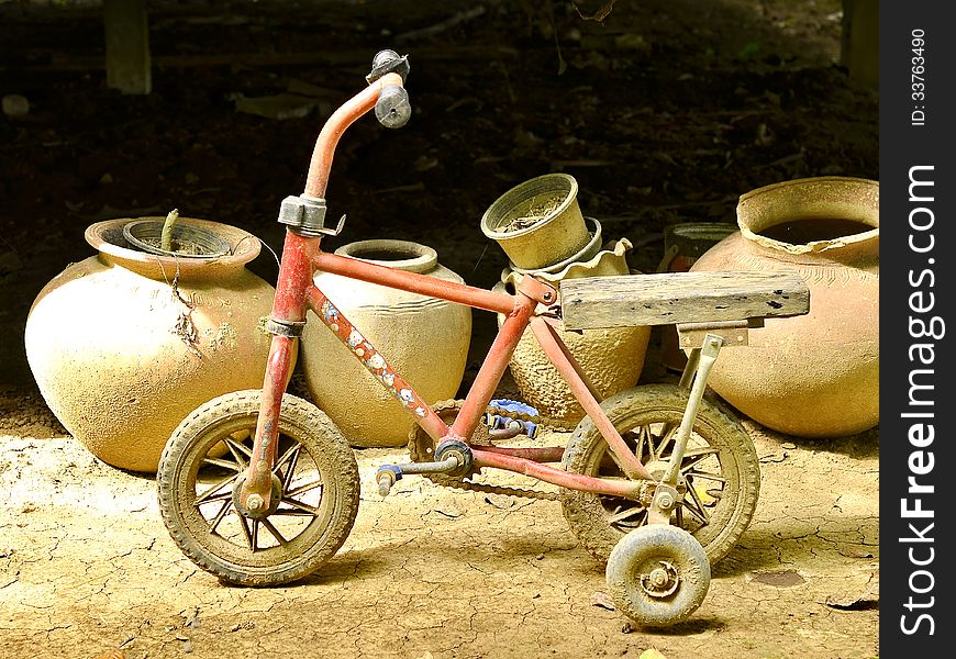 Old bicycle and jars dilapidated. Old bicycle and jars dilapidated