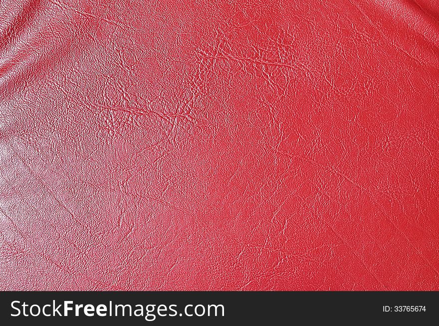 Red leather texture chair close up detail