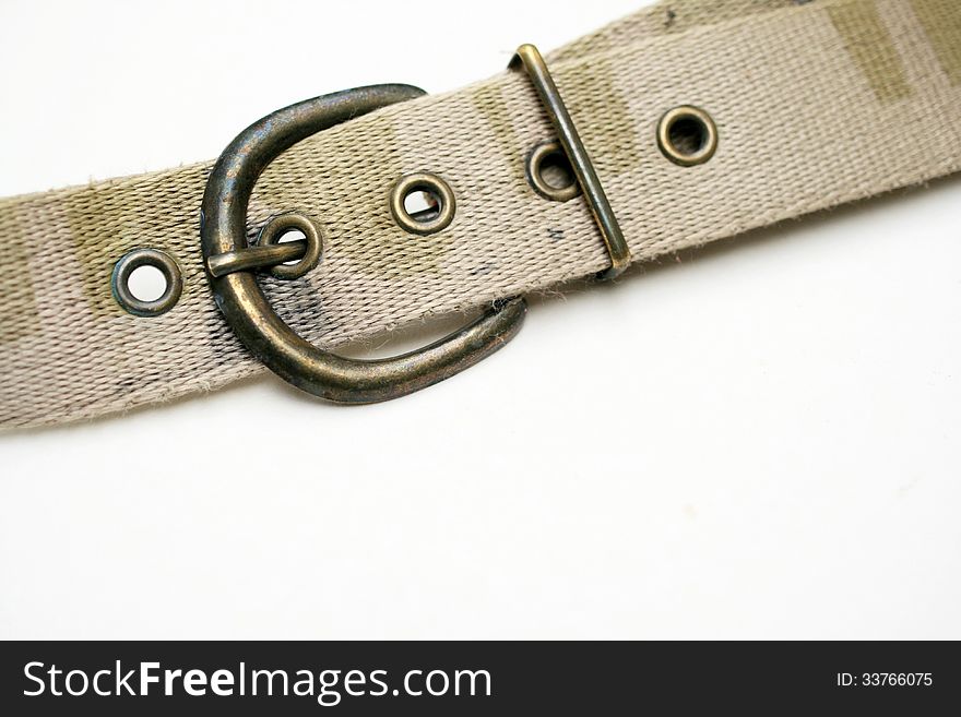 The closeup view of jean belt was taken on white background