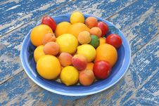 Bowl With Fresh Fruits At A Blue Colored Vintage Table Stock Photos