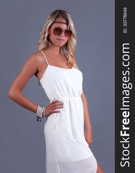 Beautiful lady in white dress and sunglass. Beautiful lady in white dress and sunglass