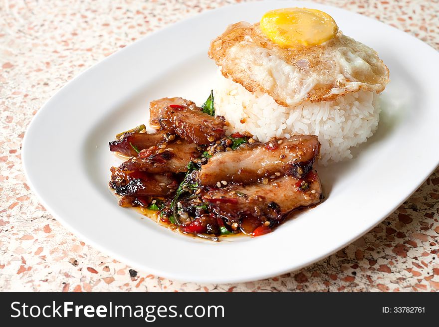 Rice with stir fried hot and spicy pork with basil