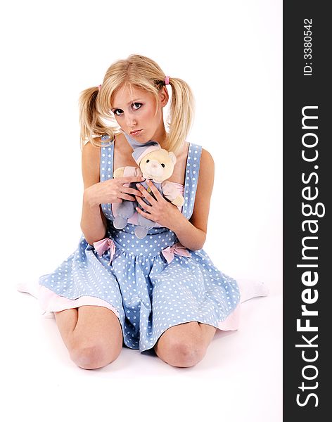 Girl with teddy bear.She is on a white background.