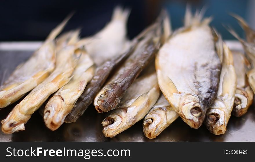 Salted and dried caspian roach on the counter. Salted and dried caspian roach on the counter