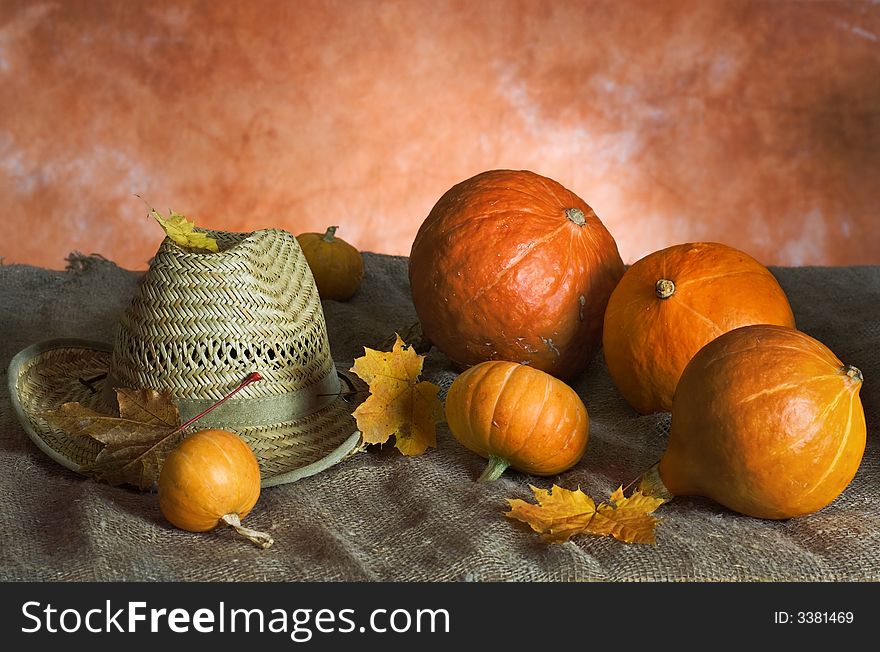 Pumpkins and sombrero on a table