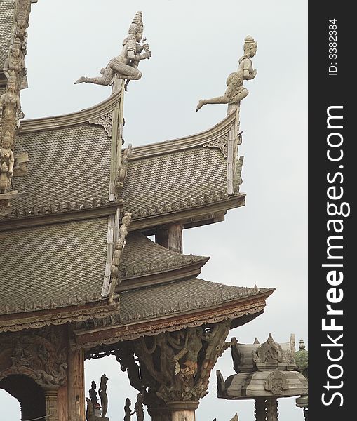 Detail of wooden, Asian temple in Pattaya, Thailand, catering for several Asian religions and philosophies. Detail of wooden, Asian temple in Pattaya, Thailand, catering for several Asian religions and philosophies.