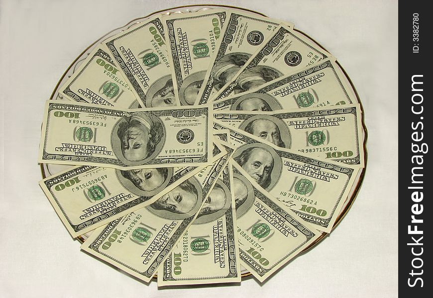 American dollars on the plate. American dollars on the plate