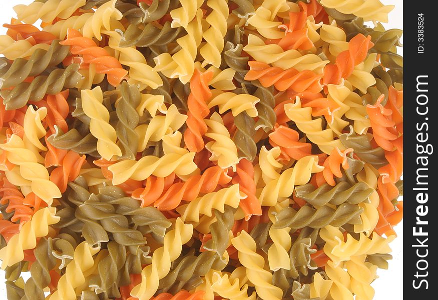 A bed of tricolor fusilli pasta