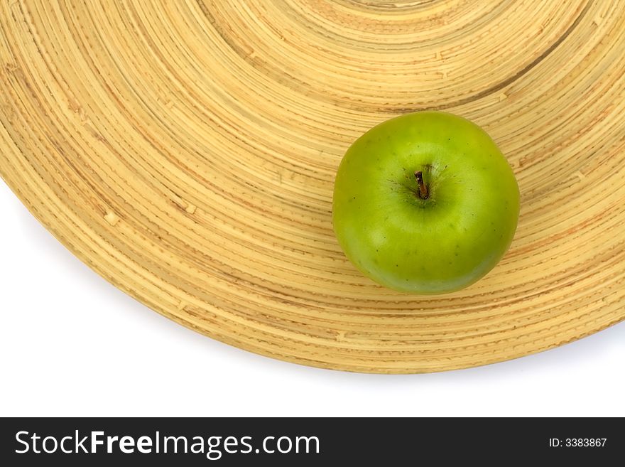 Green Apple On A Bamboo Plate