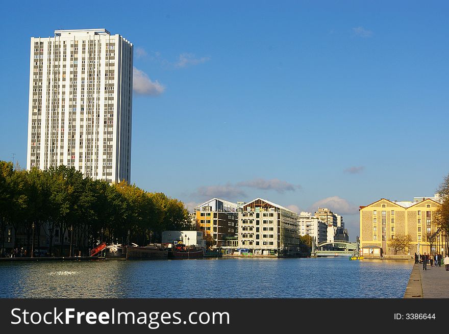 A french canal located in Paris, at the end of an autumnal afternoon. A french canal located in Paris, at the end of an autumnal afternoon.