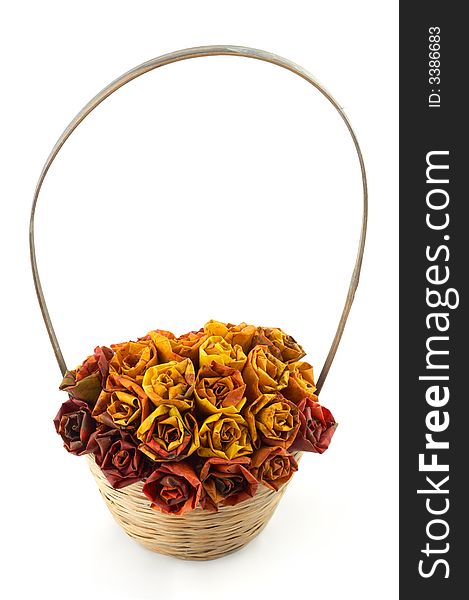 A basket with some roses made of maple leaves in it. A basket with some roses made of maple leaves in it