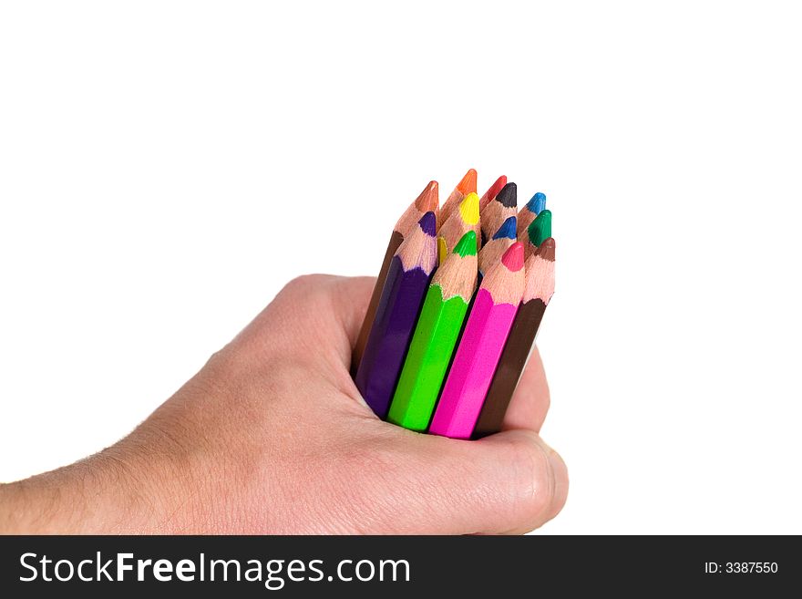 Multi colored pencils in hand on white background. Multi colored pencils in hand on white background