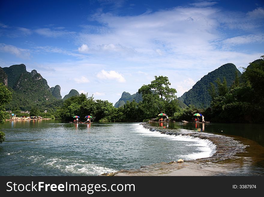 Yulong river  is very famous in china . Water is flowing,it's very good experience  to have   a drift  on local bamboo raft. Yulong river  is very famous in china . Water is flowing,it's very good experience  to have   a drift  on local bamboo raft