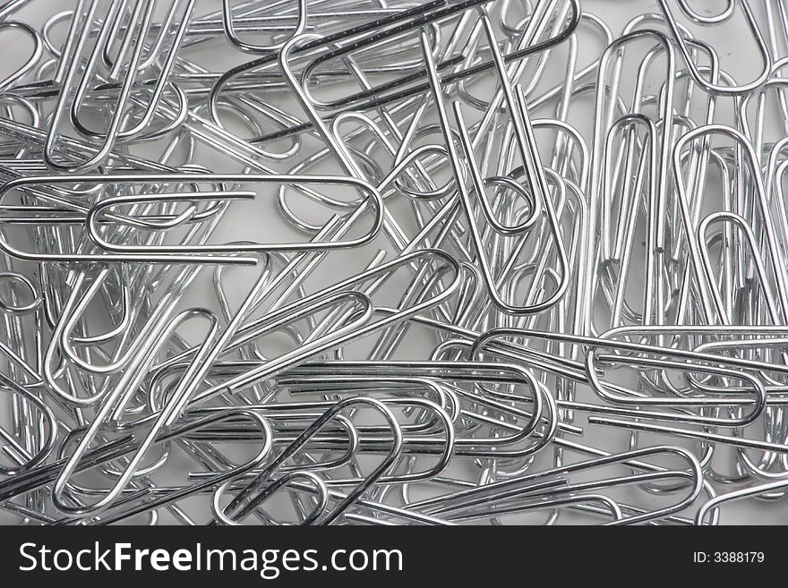 A closeup of a pile of paper clips.