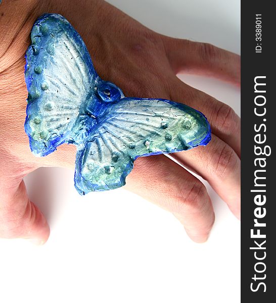 Butterfly in hand isolated in white