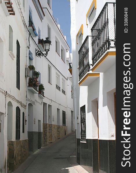 Charming street with white houses, Sevilla, Andalusia,  Spain