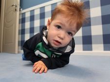 A Curious Baby Boy Lying On A Floor In Room Royalty Free Stock Photo A Curious Baby Boy Lying On A Floor In Room Royalty Free Stock Photo