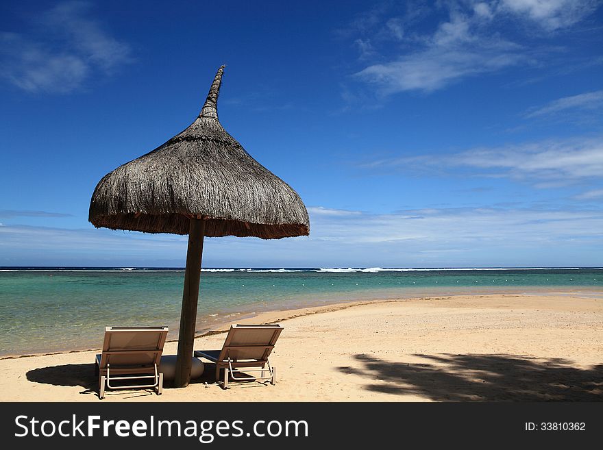 A beautiful seaview in Mauritius and there some chairs in the beach for relaxing. A beautiful seaview in Mauritius and there some chairs in the beach for relaxing