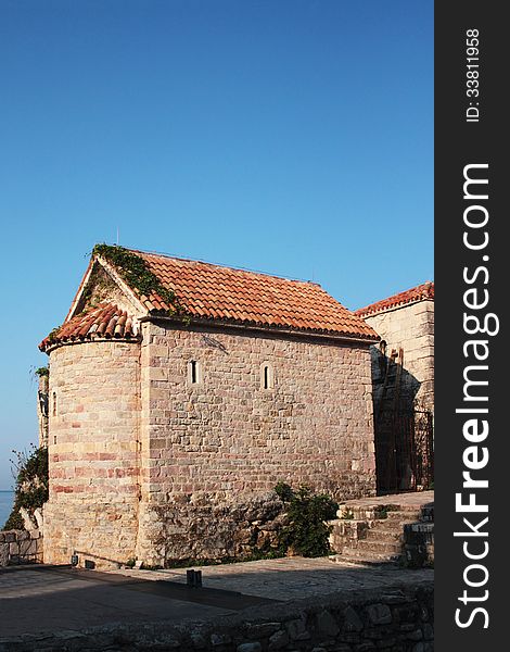 Facade of the medieval building of Romanesque style (18th century). In most cases it was used as an ammunition dump and a defensive tower. Thickness of the wall is 1 meter. Facade of the medieval building of Romanesque style (18th century). In most cases it was used as an ammunition dump and a defensive tower. Thickness of the wall is 1 meter.