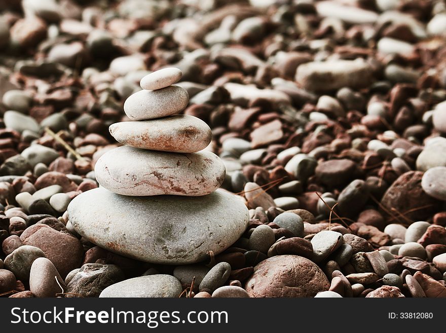 Pyramid of stones on the beach (details)